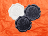 Black, Navy and White Wax Seal Featured on Orange Tissue Paper